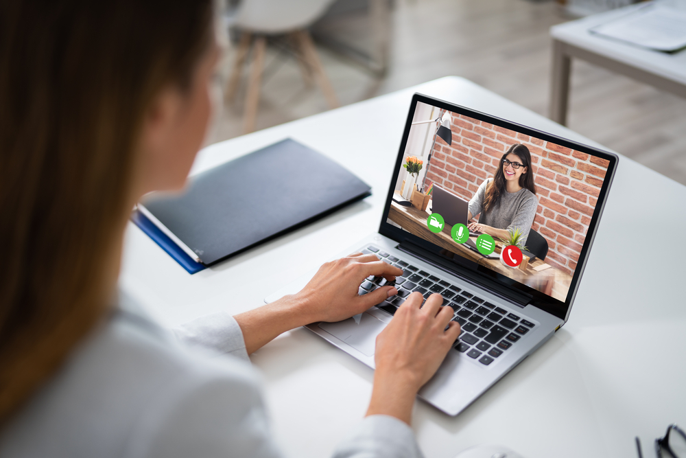 Businesswoman Using Laptop At Desk